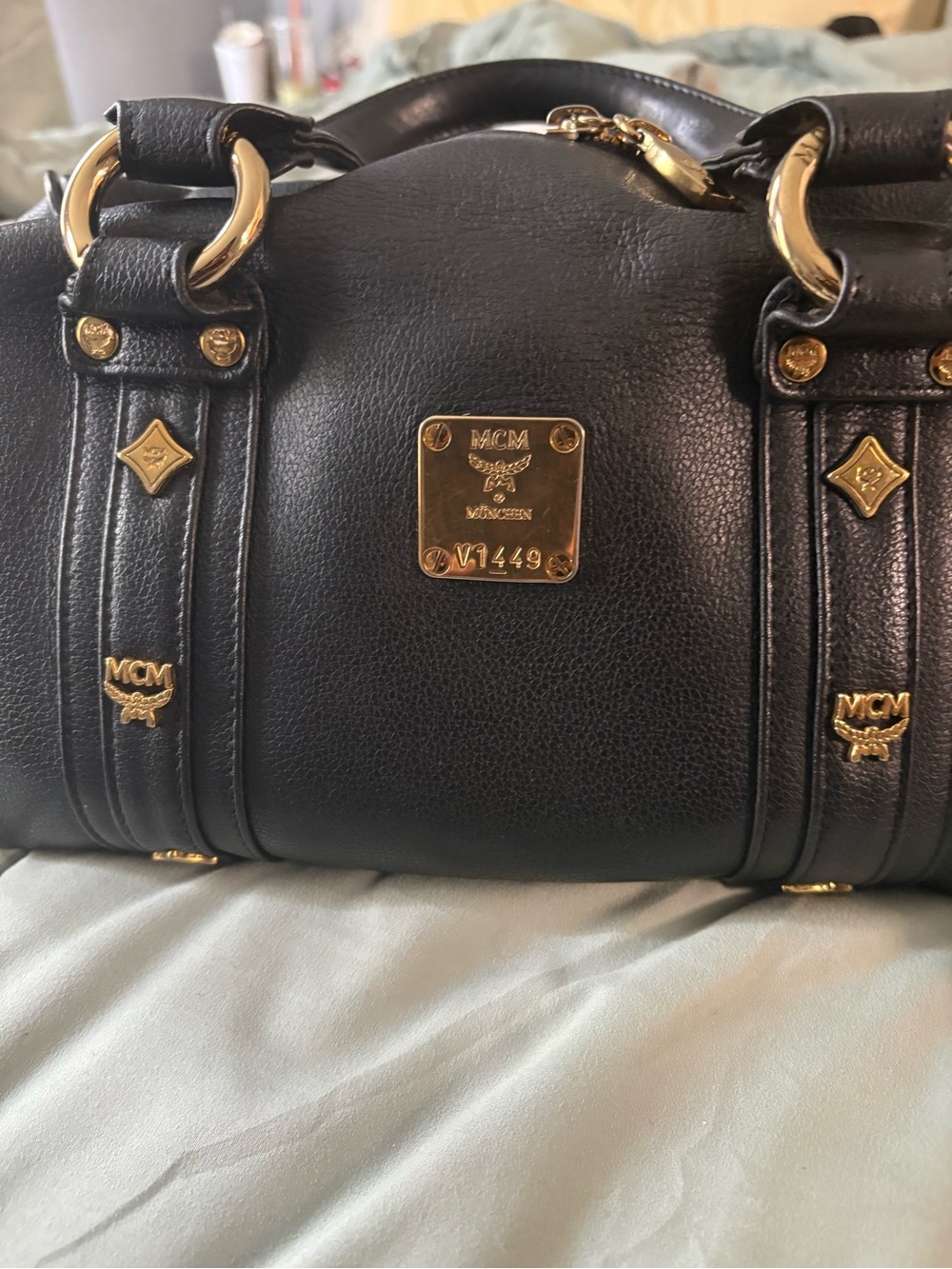 MCM Black Leather Satchel with Gold Hardware Accents